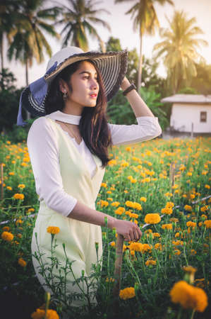 Woman in summer flowers garden , summer nature flowers time , summer trevelの写真素材