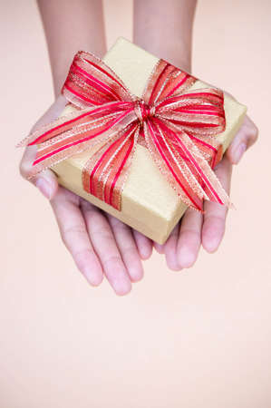 giving gift box in with hands On special days  for special person and copy space background