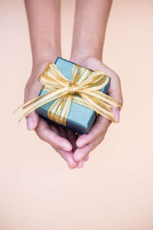 giving gift box in with hands On special days  for special person and copy space background