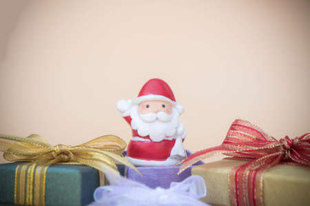 Santa Claus doll Christmas day background and gift box and copy spaceの写真素材