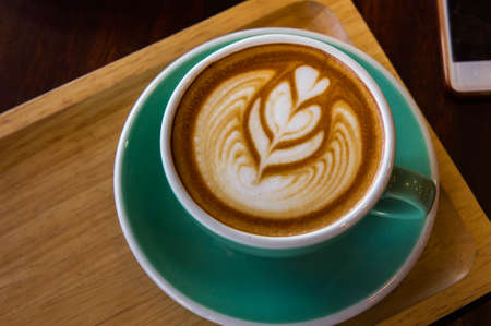 coffee time in the wood table cafe , drink coffee and tasty cakeの写真素材