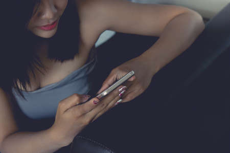 girl's playing social smartphone , looking at mobile