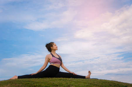 yoga girl In the morning time on blue sky background Strengthen the concentration of skin, health...