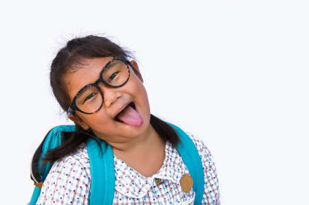 girl's smile and funny face and Get ready to bag go to school and copy space on white backgroundの写真素材