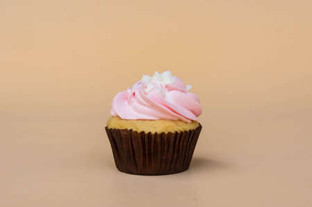 sweet cup cake dessert on yellow background and copy spaceの写真素材