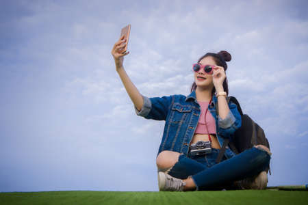 Woman selfie in the parkの写真素材