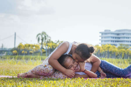Girls playing in the parkの写真素材