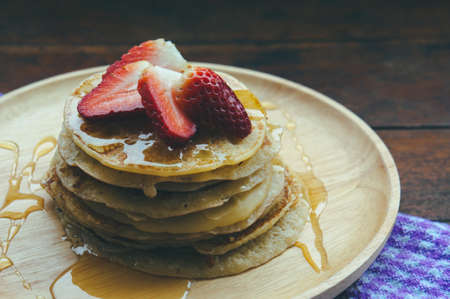pan cake dessert and honey strawberry fruit on wood dish , tasty sweet dessert