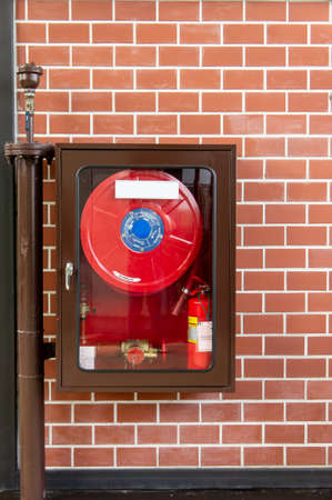 Fire Extinguishers , Fire Equipment on wall backgroundの写真素材