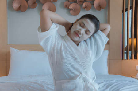 asain girl's face Face Mask pad in the room spa  , happy relaxing spa