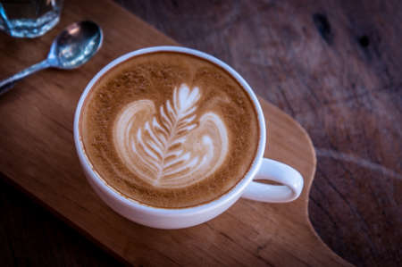 Coffee white cup classic on wood table in the morning timeの写真素材