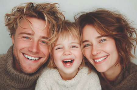 Portrait of a happy family with a child on a white backgroundの素材