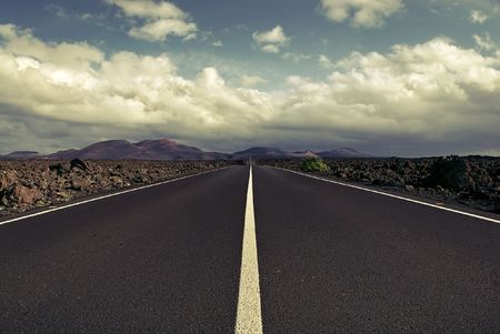 a rough road to the timanfaya national park in lanzaroteの写真素材