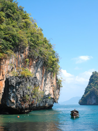 nice cliff and boat in krabi, thailand の写真素材