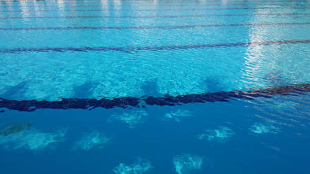 Blue water in the pool. Reflections of light on water.の写真素材