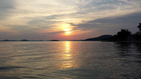 Sunset on the lake shoreの写真素材