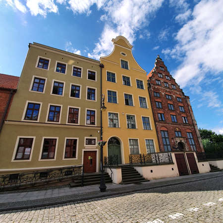 Elblag, Poland - July 21, 2020: Beautiful various tenement houses in the Polish city of Elblag