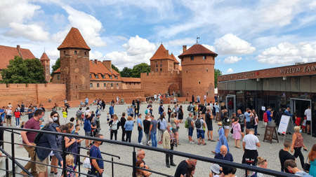 Malbork, Poland - June 25, 2020: Tourists are visiting the Teutonic Castle in Malbork, Poland