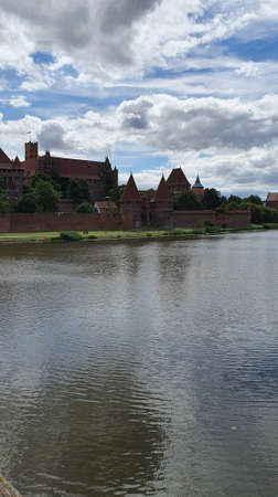 Malbork, Poland - June 25, 2020: Castle in Malbork on the Nogat River, Poland