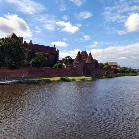 Malbork, Poland - June 25, 2020: Castle in Malbork on the Nogat River, Polandのeditorial素材