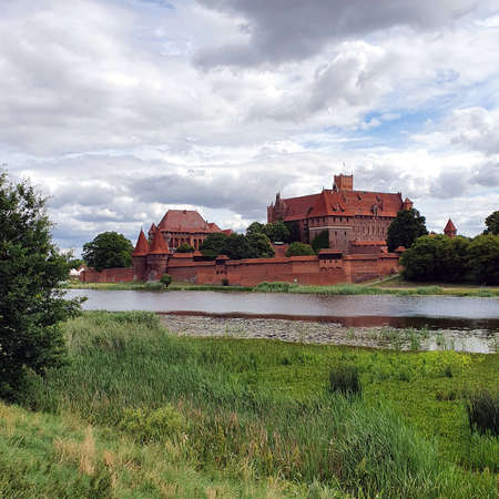 Malbork, Poland - June 25, 2020: Castle in Malbork on the Nogat River, Poland