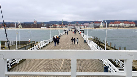 Sopot, Poland - January 3, 2021: Pier in Sopot, Poland. People walking around the pier in Sopot. View towards the city.のeditorial素材