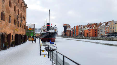 Gdansk, Poland - February 7, 2021: View of Gdansk old Town from the Motlawa River, Poland. Ancient...