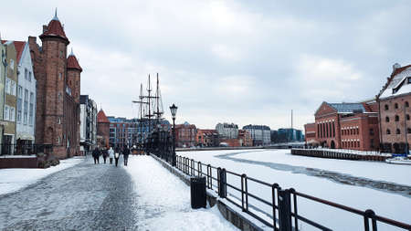 Gdansk, Poland - February 7, 2021: View of Gdansk old Town from the Motlawa River, Poland. Ancient...