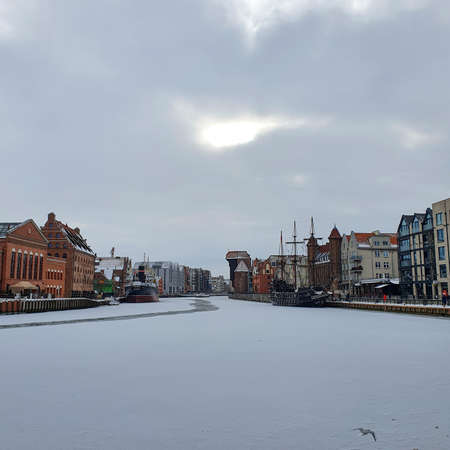 View of Gdansk old Town from the Motlawa River, Poland. Ancient European city. Winter scenery.