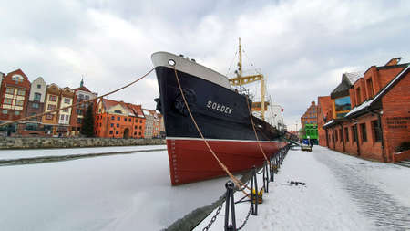 Gdansk, Poland - February 7, 2021: Museum bulk carrier ship Soldek moored at Old Motlawa River embankment in Gdansk, Poland. Winter scenery.のeditorial素材