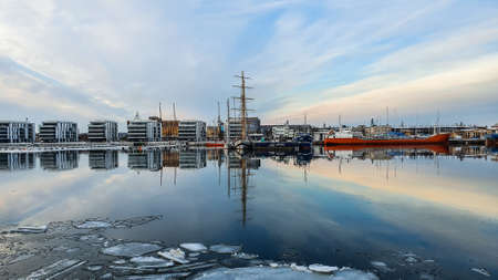Amazing pink blue white sky above the bay in the city of Gdynia, Poland. Mirror effect.