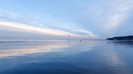 Amazing pink blue white sky above the bay in the city of Gdynia, Poland. Mirror effect.の写真素材