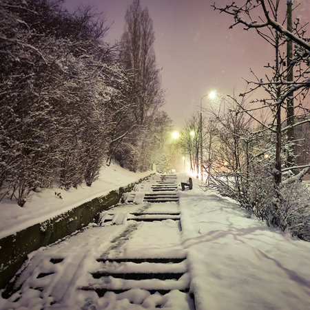 Fabulous winter climate. Snow-covered walkway and stairs in the colors of the morning. Gdynia, Polandの写真素材