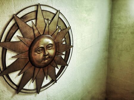 A sun wall ornament set on the wallの素材