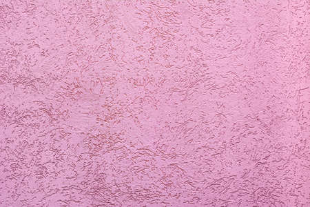 Concrete wall texture with scratches and relief. Orange and pink color. Accuracy Beautiful background with place for textの写真素材