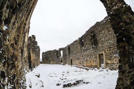 Nevitsky castle in snowy weather. Architecture memo. Remains of a fortress in the village of Nevitskoe. Transcarpathia. Ruin of the 13th century near the village of Kamyanitsaのeditorial素材