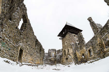 Nevitsky castle in snowy weather. Architecture memo. Remains of a fortress in the village of Nevitskoe. Transcarpathia. Ruin of the 13th century near the village of Kamyanitsaのeditorial素材