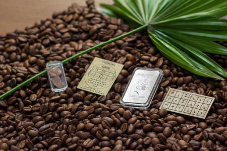 Soviet Union coins fall on coffee beans. Two dollars in silver. Charms and bark of the Mamvri oak....