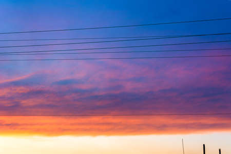 Natural Sunset. Bright Dramatic Sky And Dark Ground. Landscape Under Scenic Colorful Sky. Sun Over Skyline, Horizon. Transcarpathia and Uzhhorod. Magic Sunset. Dusk. Cloudsの写真素材
