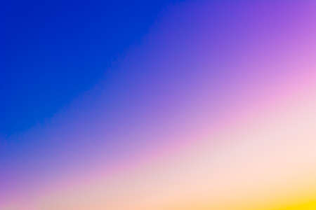 Sunrise and sunset. Bright sky. Twilight colors. Saturation. Light Blue, Blue, Yellow, Purple, Orange. Background with space for textの写真素材