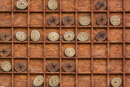 Board game tic-tac-toe on a large wooden board. Family leisure and entertainment. Logical games for...