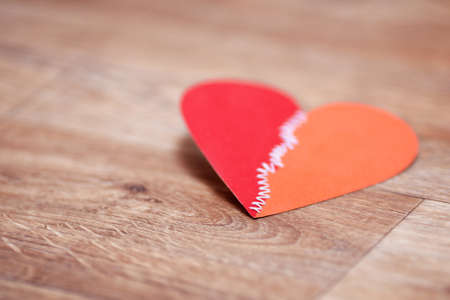 Valentine's day greetings card on the wooden floor. Very shallow focus.の写真素材