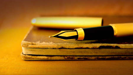 Old books and fountain penの写真素材