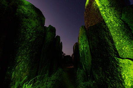 Stone Megalithic monument. Dolmens painted with green light, creating horror effect. Huelva, the iberian town El Pozueloの素材 [FY310204837760]