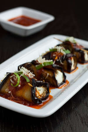 Eggplant rolls stuffed with cottage cheeseの写真素材