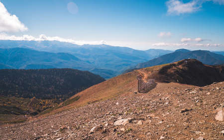 Magnificent view on beautiful mountain range in blue haze in background in Rosa Khutor near Sochi,...