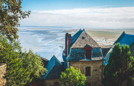 Houses inside walls of Le Mont Saint-Michel island famous for its low tide, in Normandy, Franceの写真素材