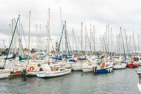Variety of yachts and boats moored in harbour of port city of Saint-Malo, Brittany, Franceの写真素材
