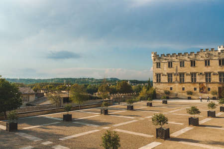 Petit Palais Museum, former Cardinal residence in 14th century, now museum with crenelated facade and mullion windows in Avignon, Franceのeditorial素材