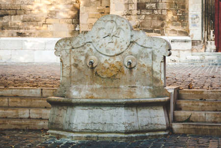 Fountain Saint Jean de Malte decorated with cross, symbol of Maltese Order in Aix-en-Provence, Franceの写真素材